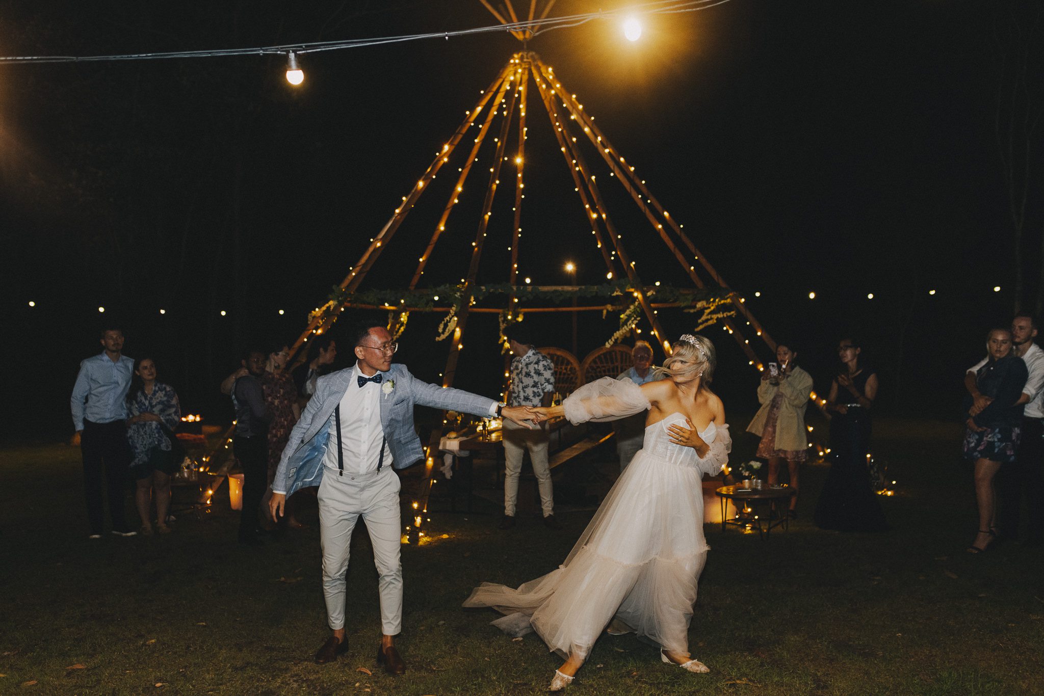 Dancing under tipi with fairy lights